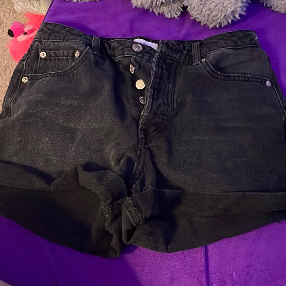 Longer, black jean shorts